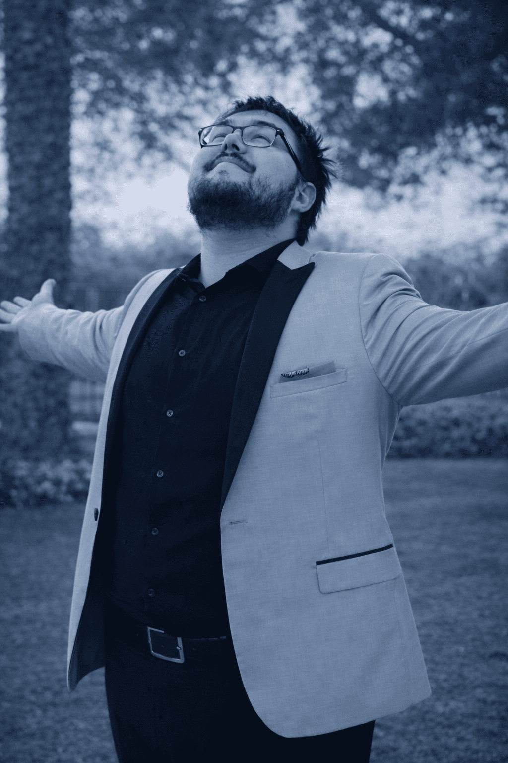 Jordan with arms outstretched, looking up